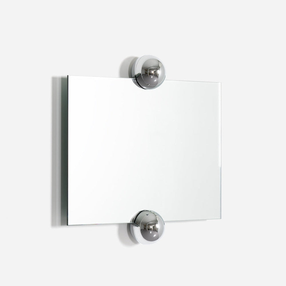 Rectangular wall mirror with chrome ball details by Moustache Paris against a plain white wall.
