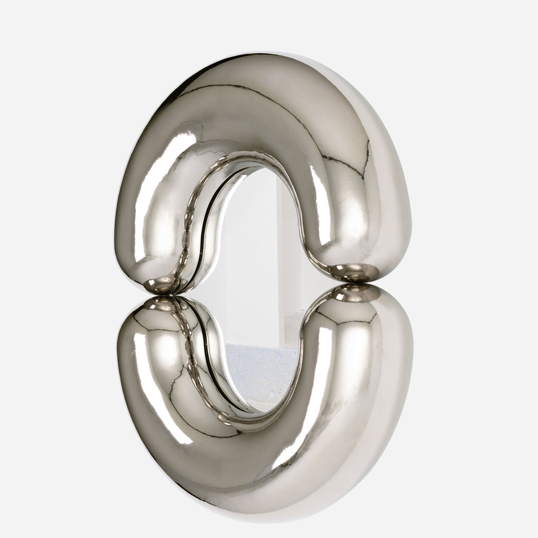 Platinum mirror by Moustache Paris with rounded, inflated design, reflecting a white interior.