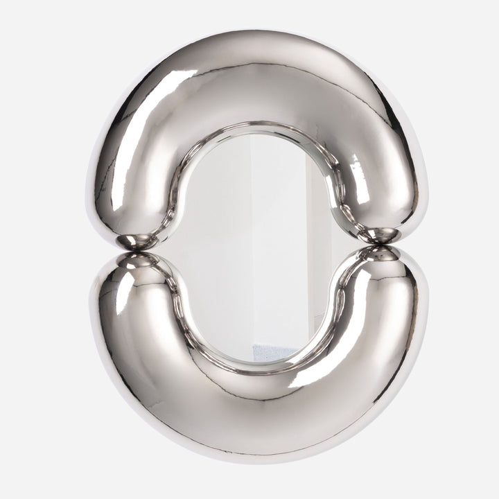 Platinum mirror by Moustache Paris with a plump, abstract, and reflective surface.
