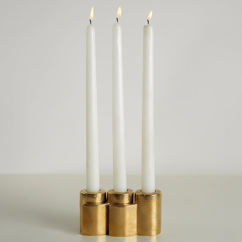 Snug candle holder by stem in brass