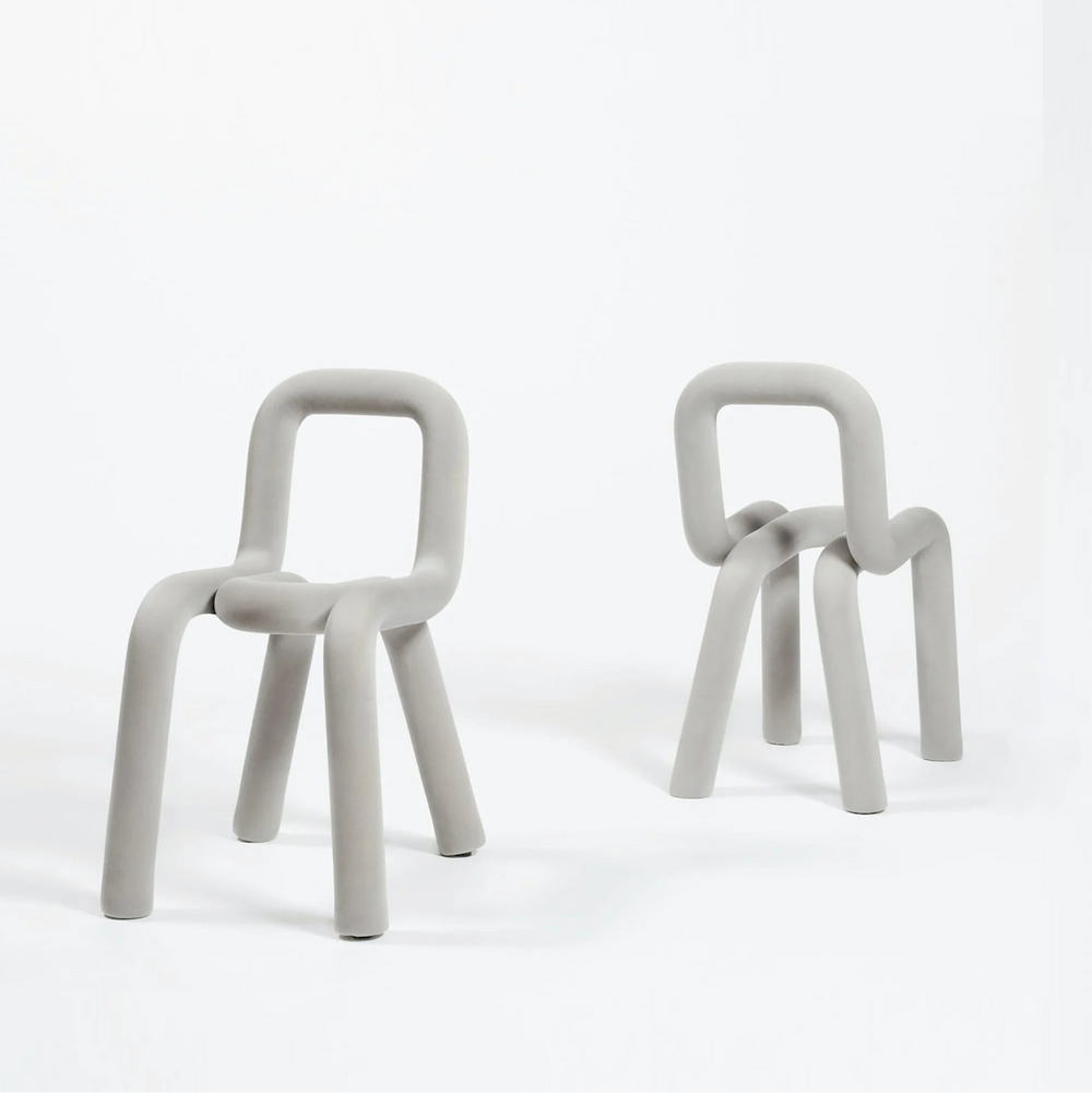 Light grey Moustache Bold chair by Moustache with a rounded tubular design, shown against a plain white background.
