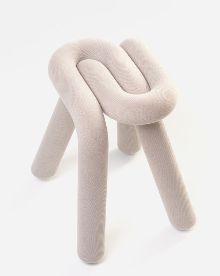 Beige fabric stool by Moustache, featuring a knotted design and three legs.