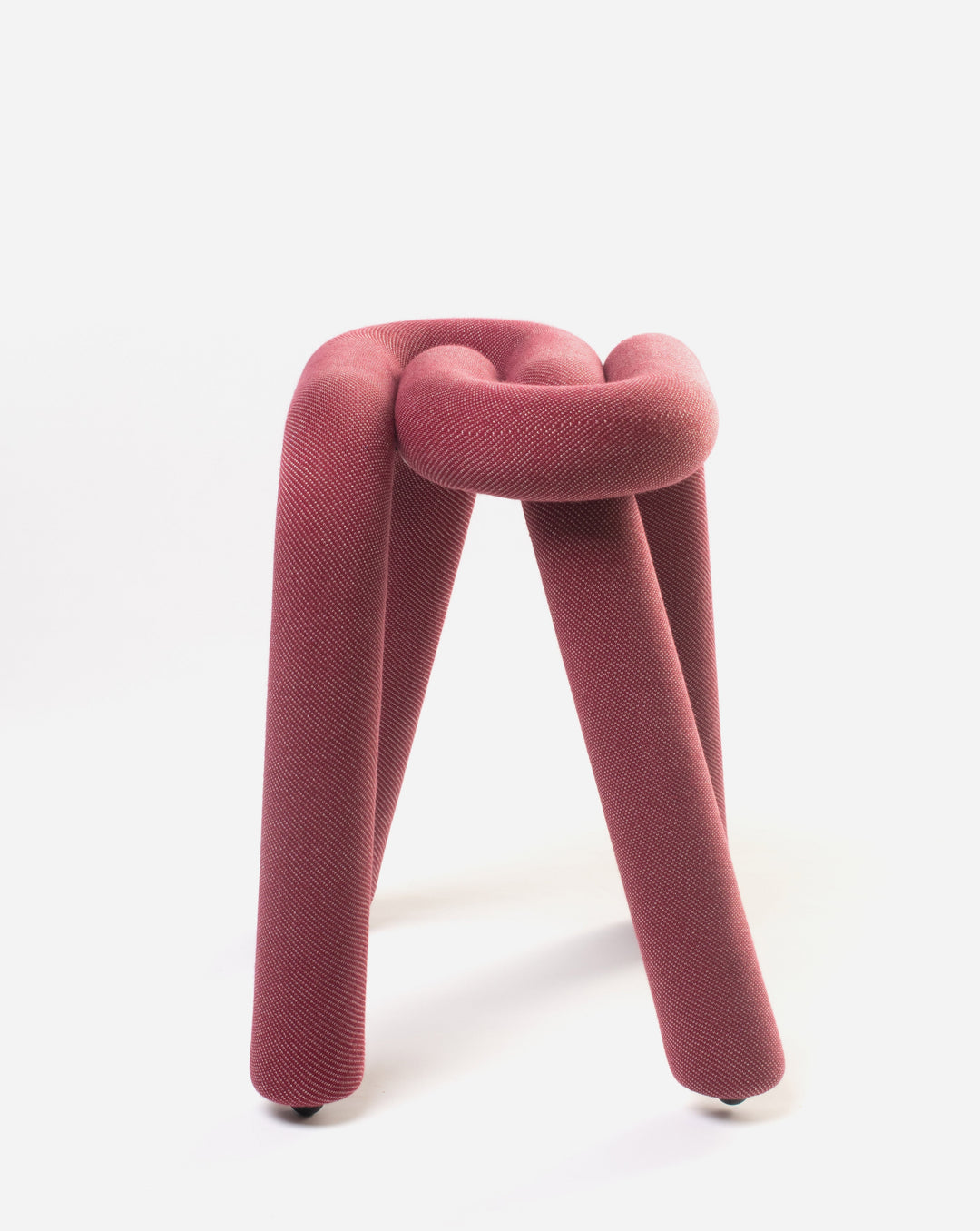 Purple stool by Moustache with a looped design and textured fabric.
