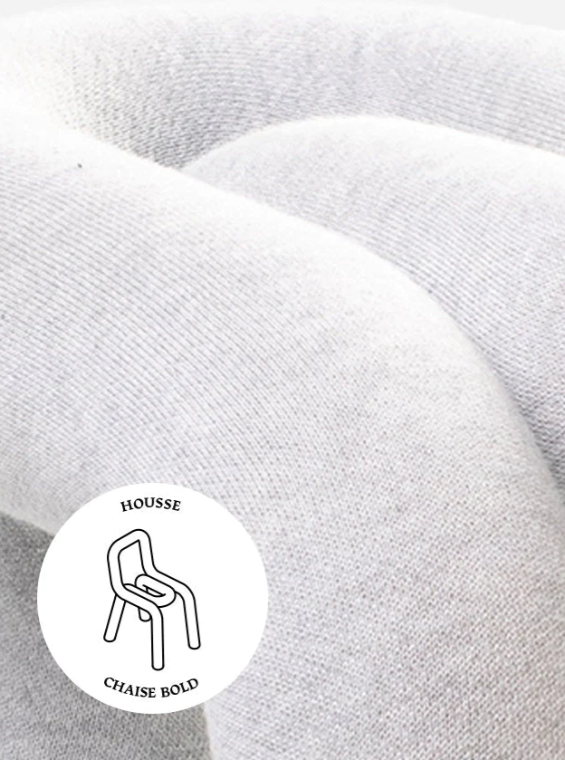 Grey chair cover by Moustache Paris, close-up shot showing soft, textured fabric.