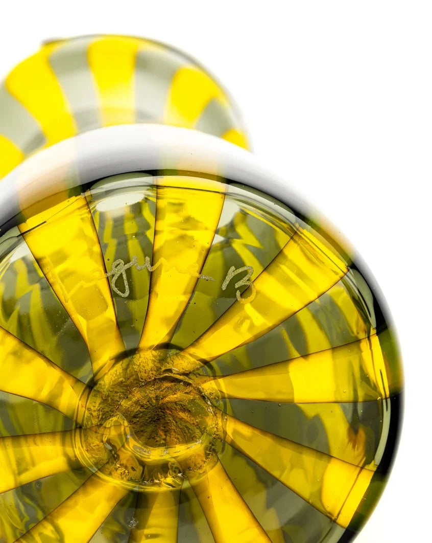 Yellow and grey striped glass carafe by Laguna-B with a circular bottom.