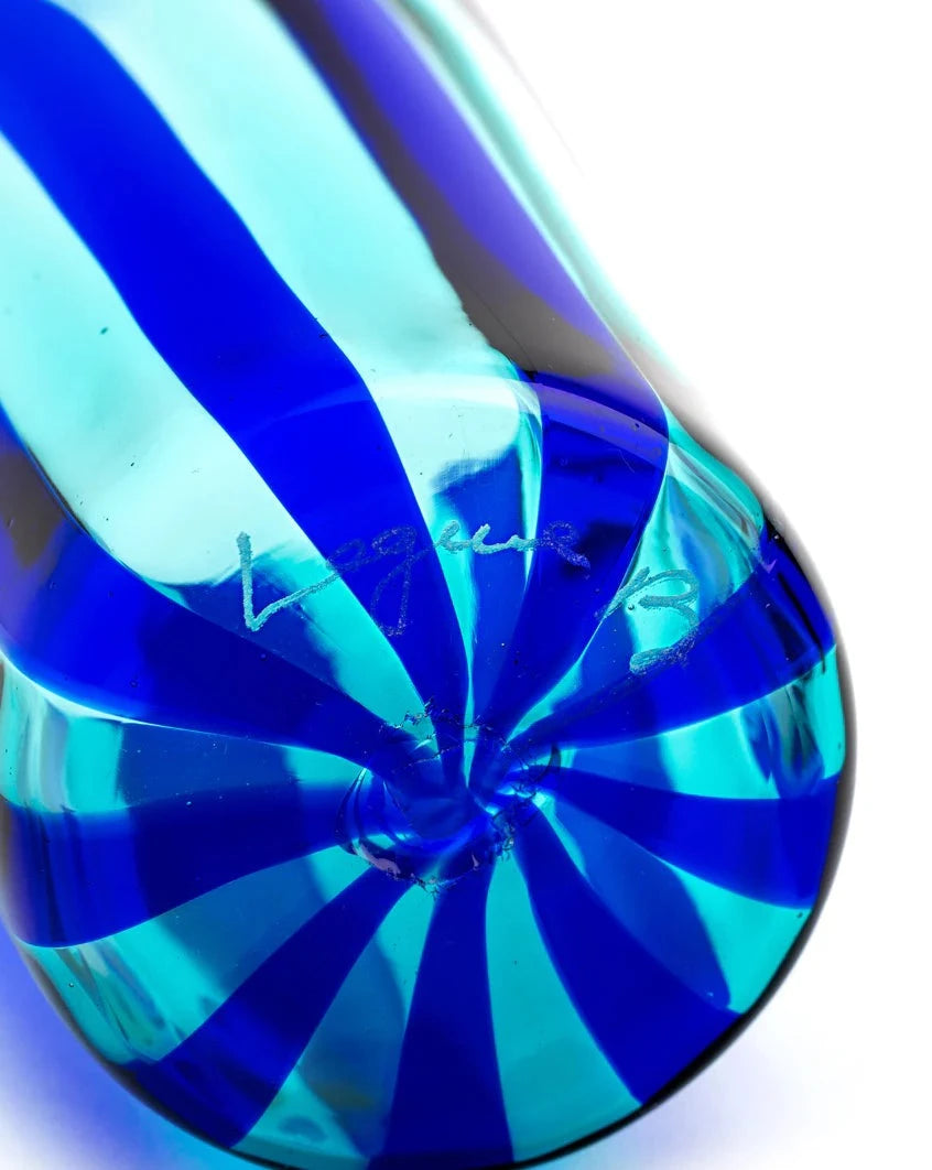 Blue and marine drinking glass tumbler by Laguna-B, featuring a swirled striped pattern.