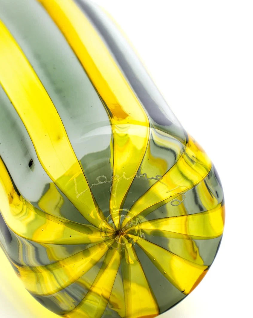 Yellow and steel tumbler by Shop Dessein Parke with a spiraling striped design from the base.