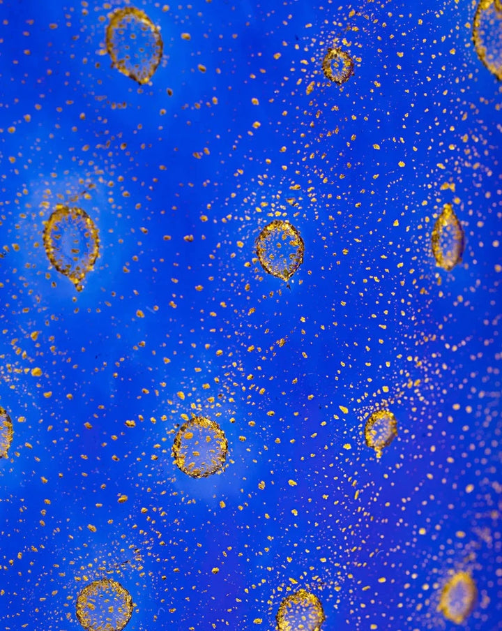 Crystal and gold "Bolle" tumbler by Laguna-B, decorated with bubble-like texture.