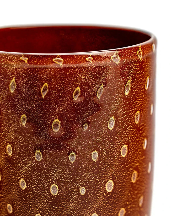 Brown and gold Bolle tumbler glassware by Laguna-B, featuring a bubbled, dotted pattern.