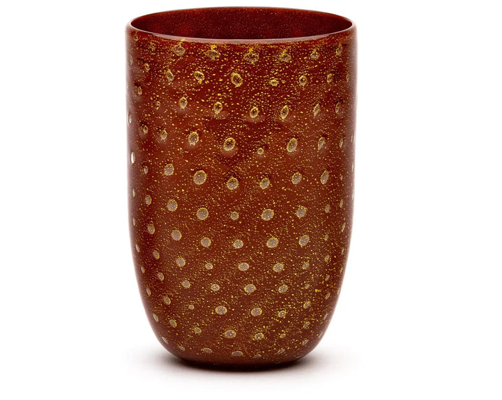Gold tumbler by LAGUNA-B, featuring a dotted pattern over a mottled brown background.
