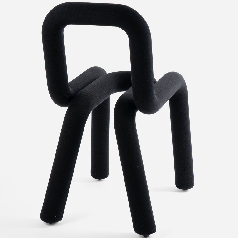 Black chair by Moustache Paris with a tubular design against a white background.