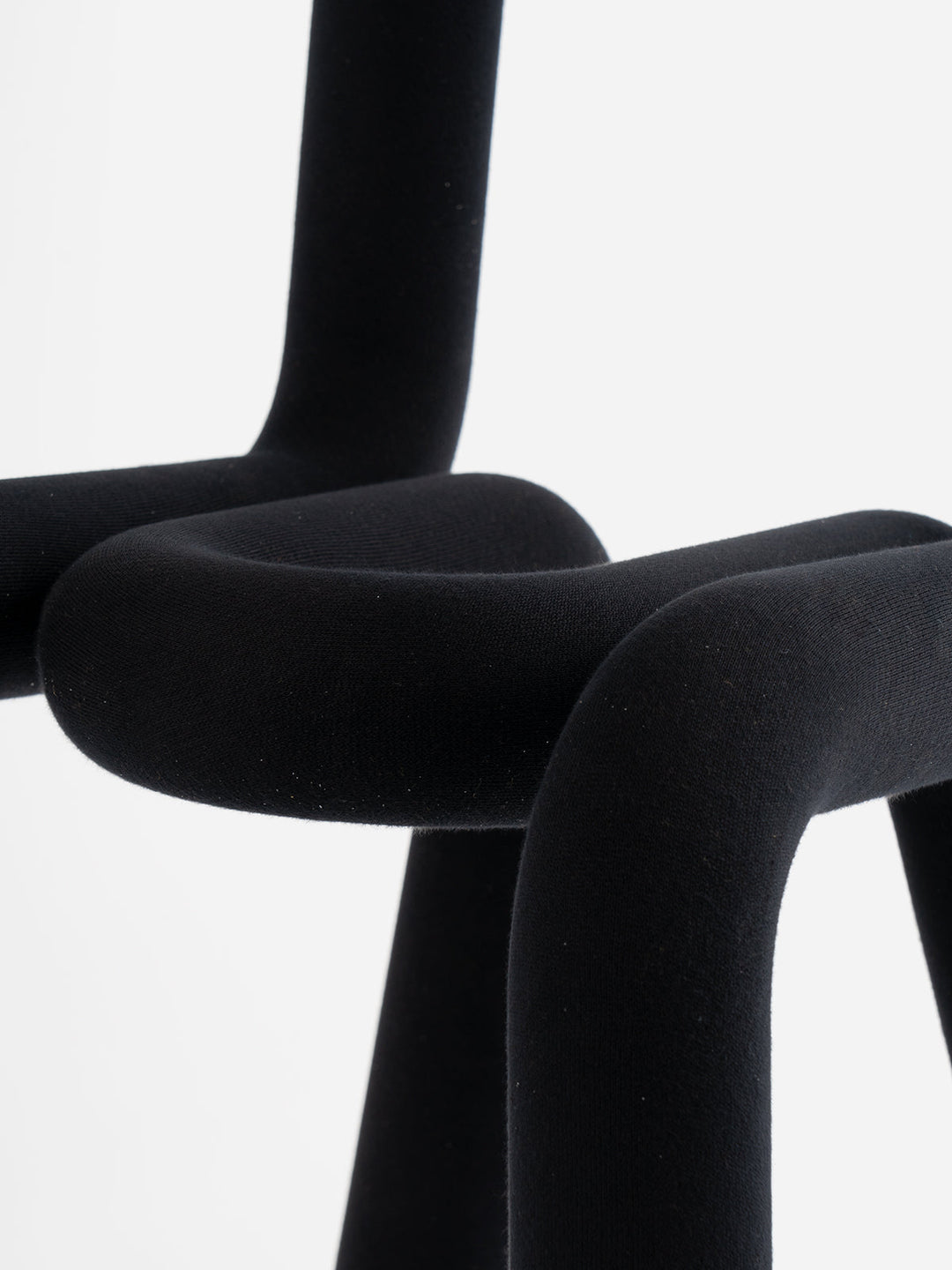 Black Moustache Bold Chair by Moustache Paris with a tubular, minimalist design against a white background.