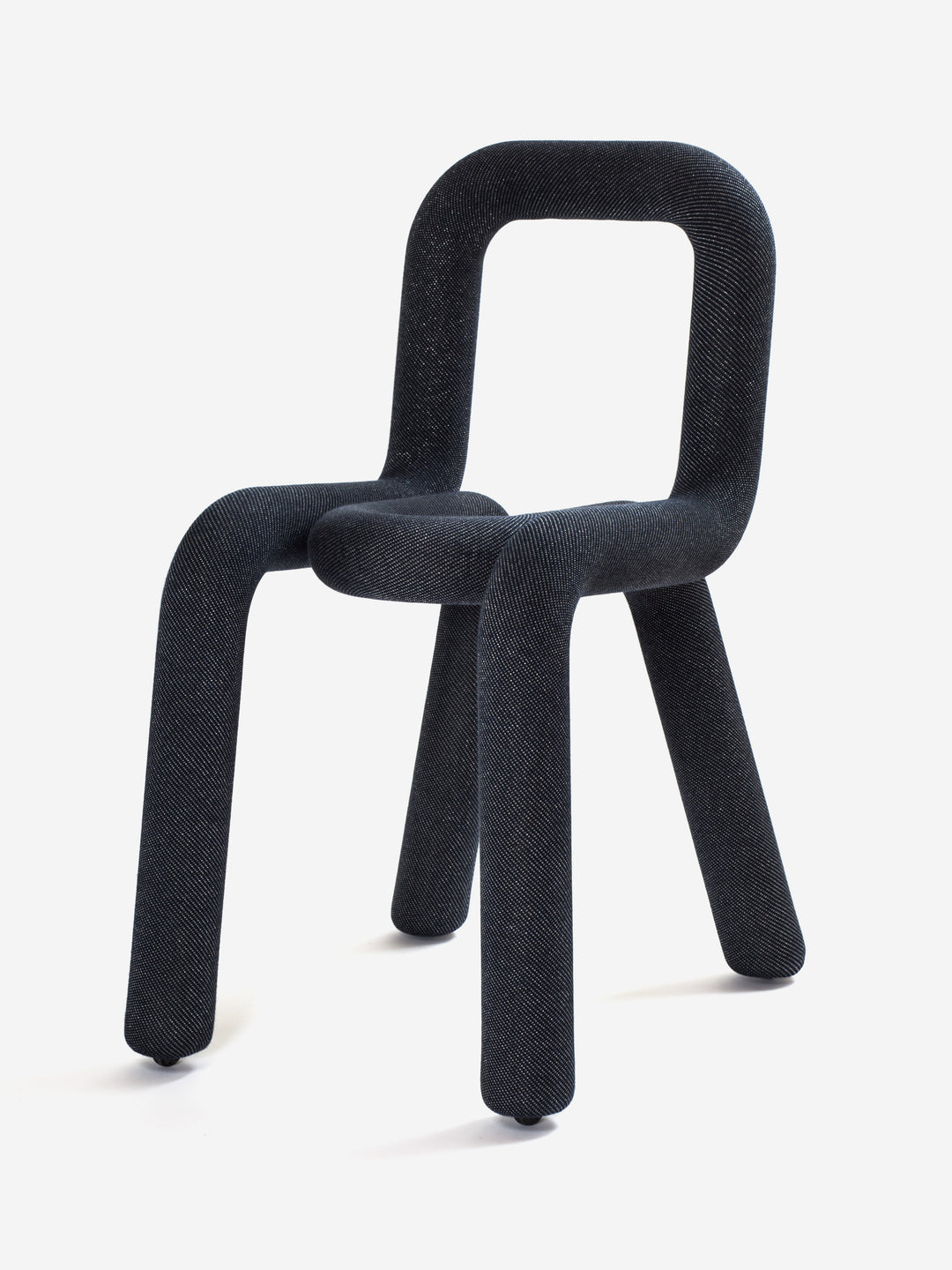 Black upholstered chair by Moustache Paris with rounded tubular frame and denim-like fabric.
