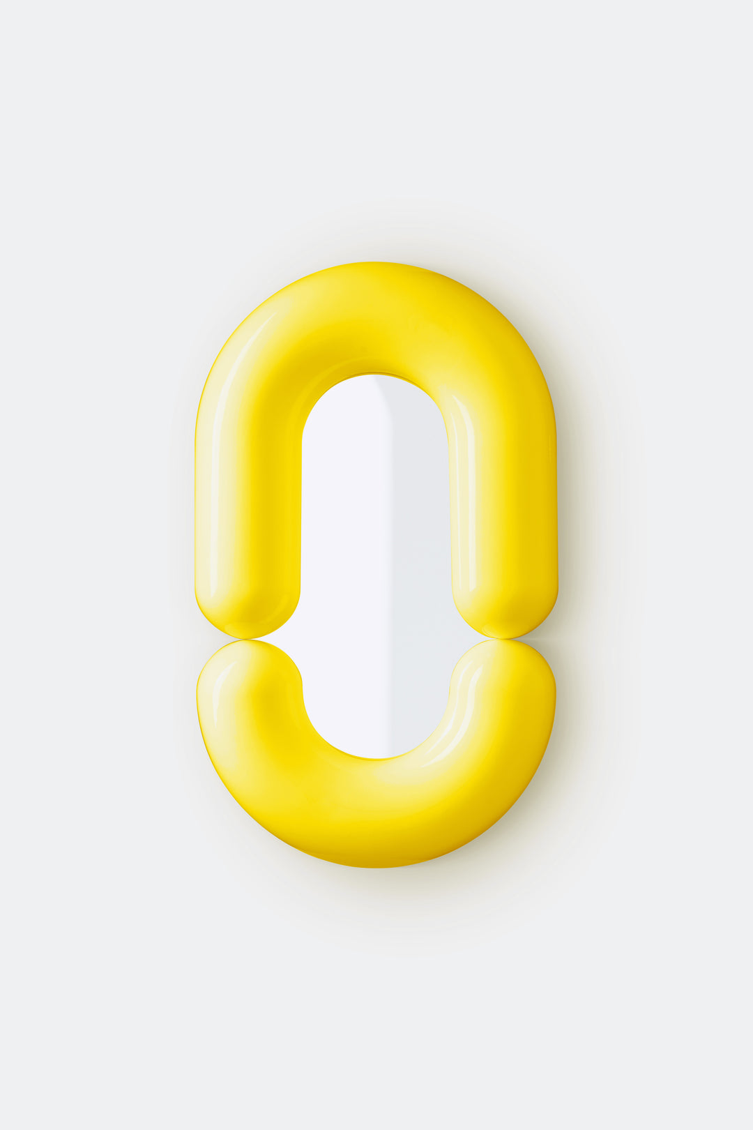 Yellow wall mirror by Moustache Paris with a smooth, glossy finish, and a rounded, minimalist design.