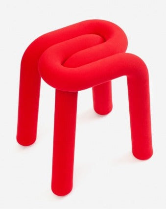 Red Moustache Bold stool by Moustache Paris with a looping design and tubular legs.
