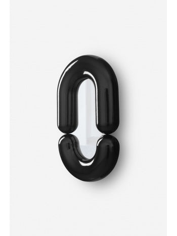 White zodiac wall mirror by Moustache Paris, featuring a glossy, black frame in a unique, rounded geometric design.